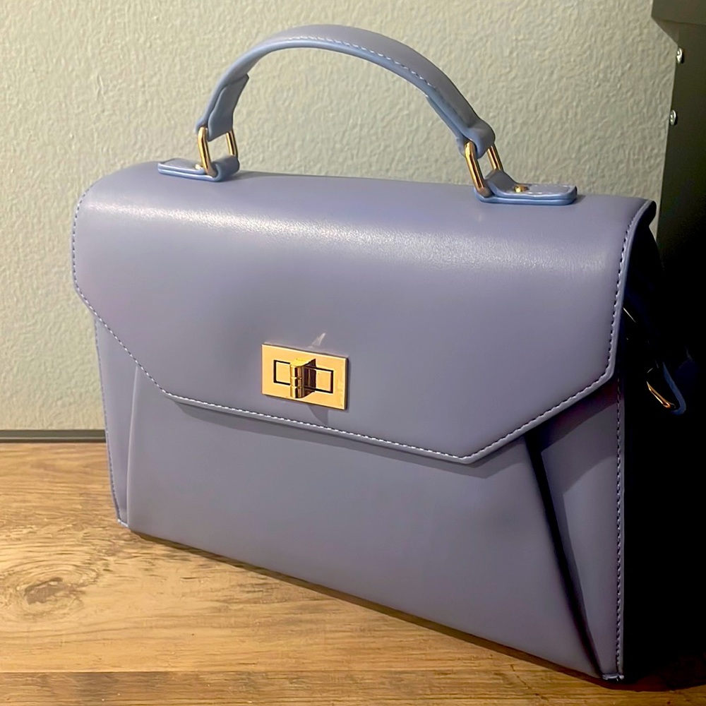 Periwinkle faux leather Medium Sized Purse with crossbody strap. Never used